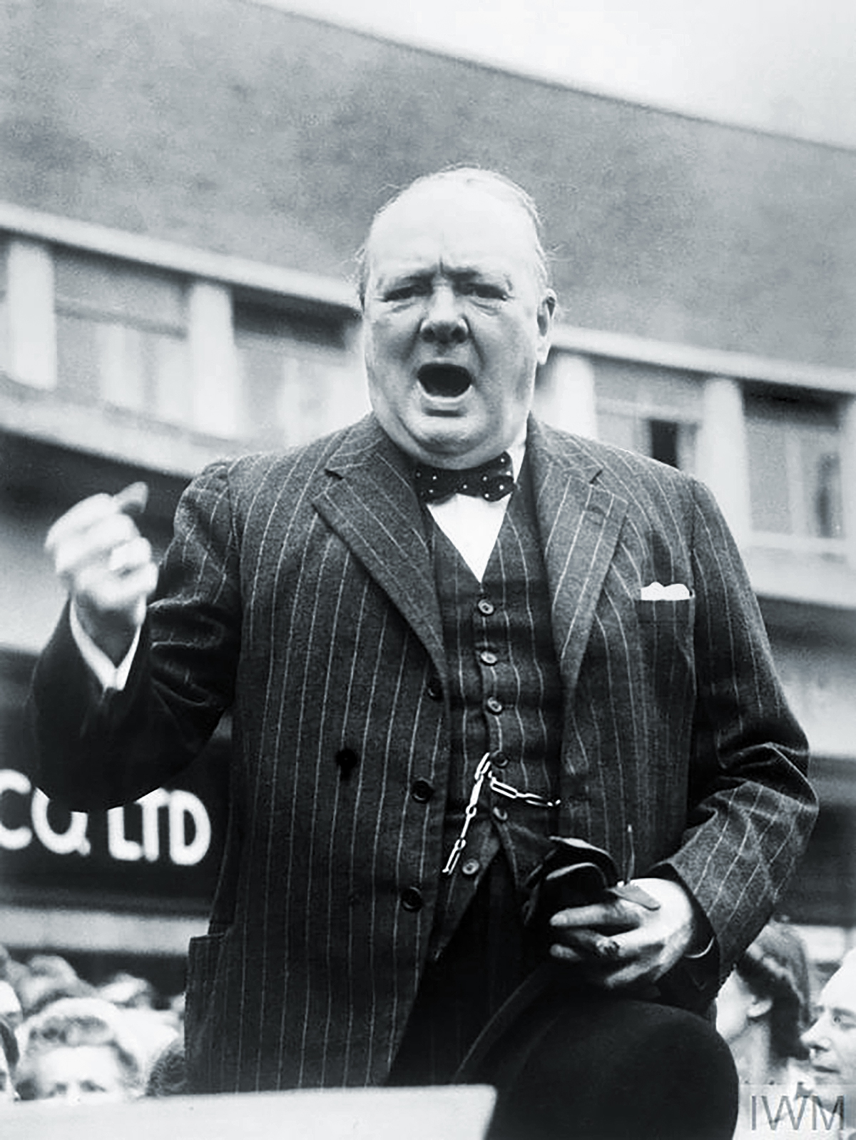 Churchill giving his famous V for Victory sign